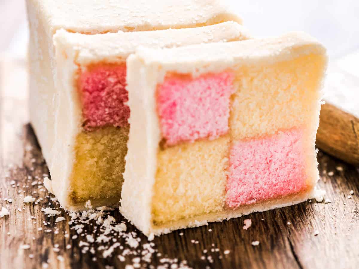 Traditional check Battenberg sponge cake, homemade sweet treat served at Easter in the UK and much of the commonwealth countries at holidays.