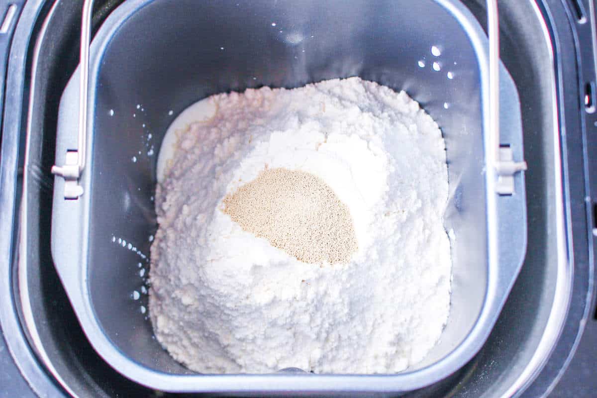 flour and yeast in a baking pan.