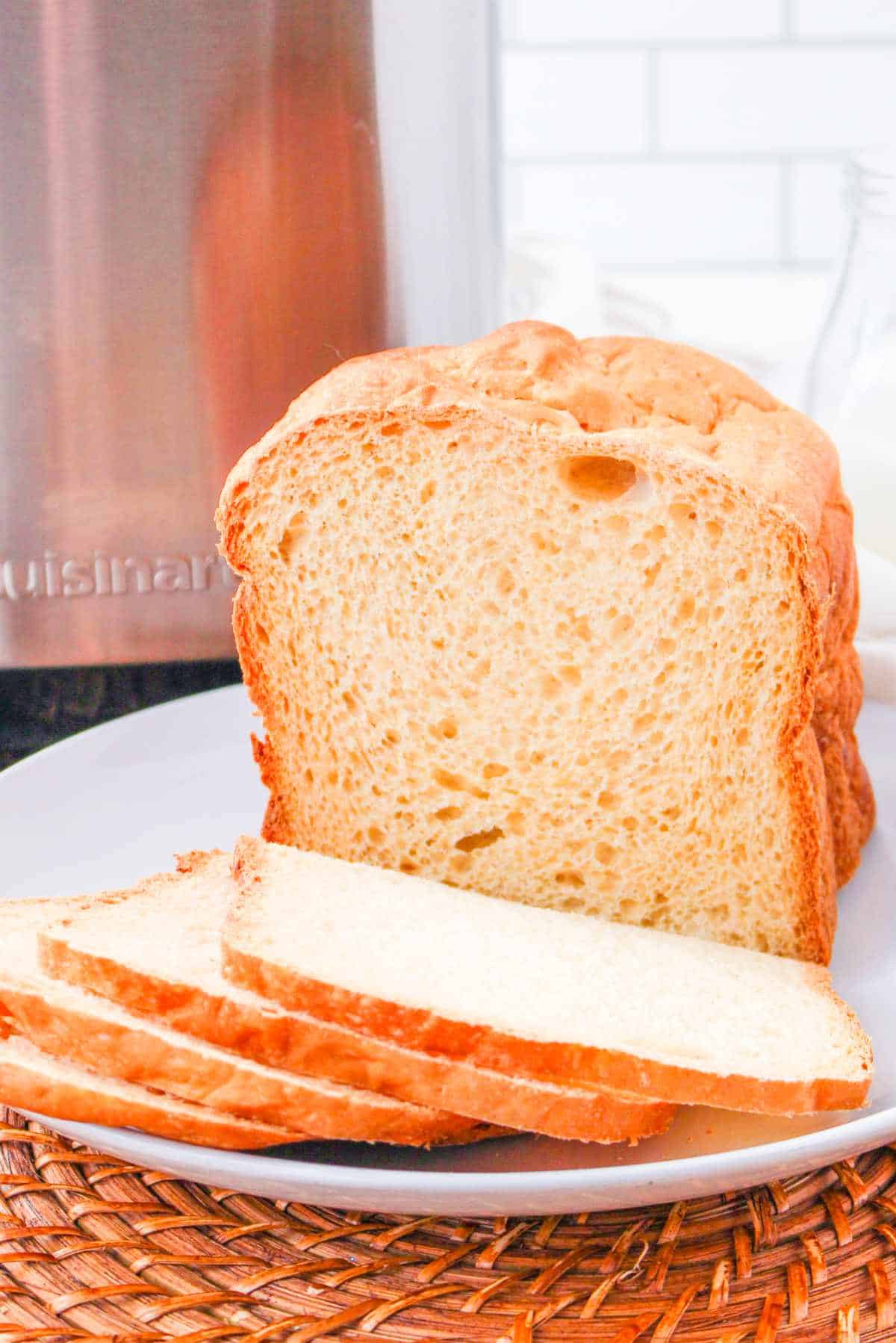 Sliced bread machine sandwich bread on a plate.