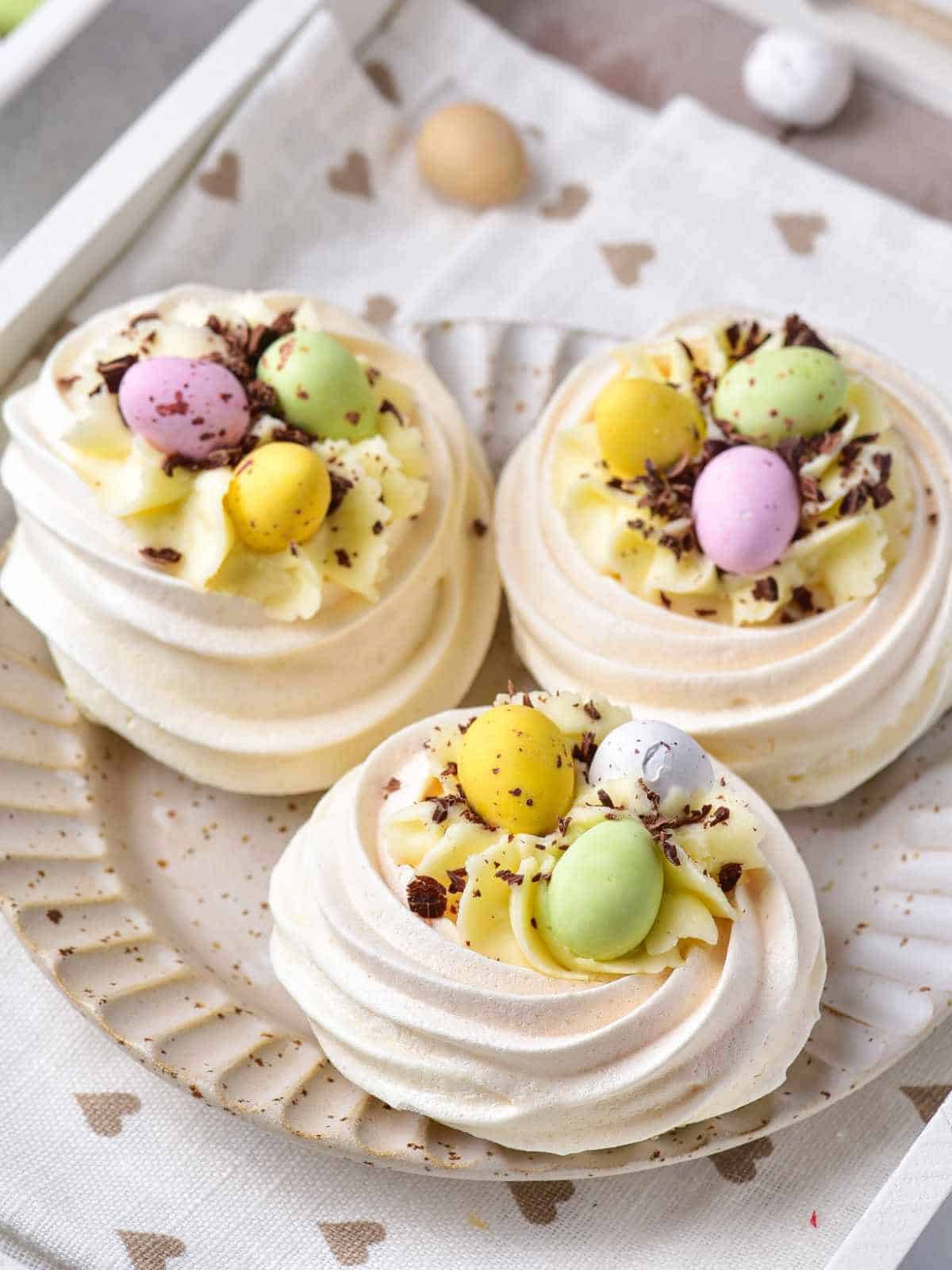 Filled mini meringue nests with cheesecake filling and Cadbury Mini eggs.