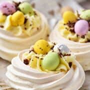 Filled mini meringue nests with cheesecake filling and Cadbury Mini eggs.