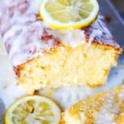 lemon loaf cake with icing drizzled on top.