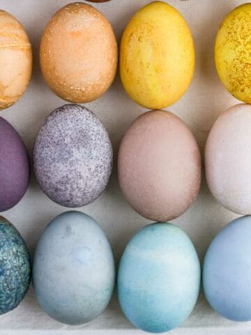 Natural egg dyes in blue, purple, yellow, and orange.
