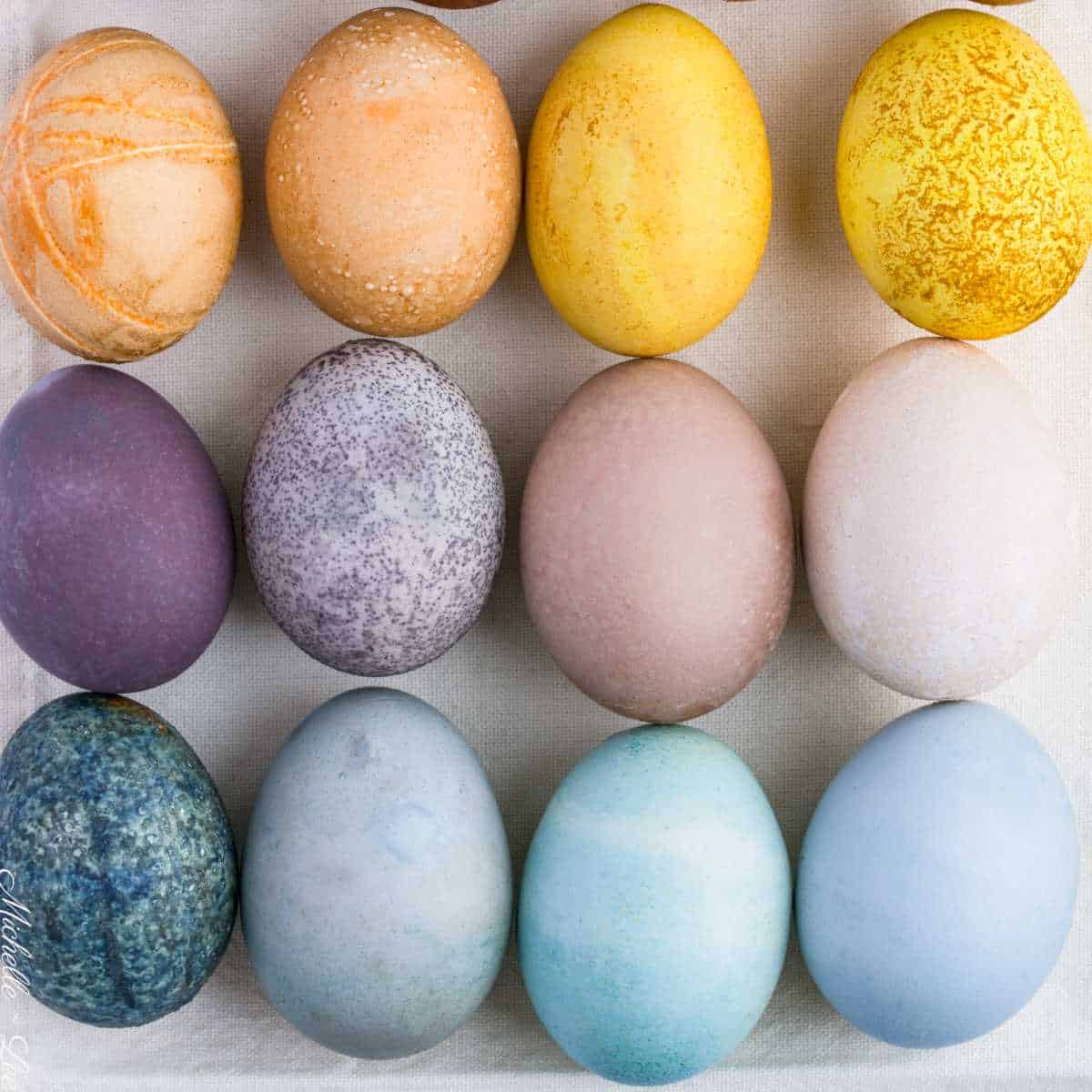 Natural egg dyes in blue, purple, yellow, and orange.