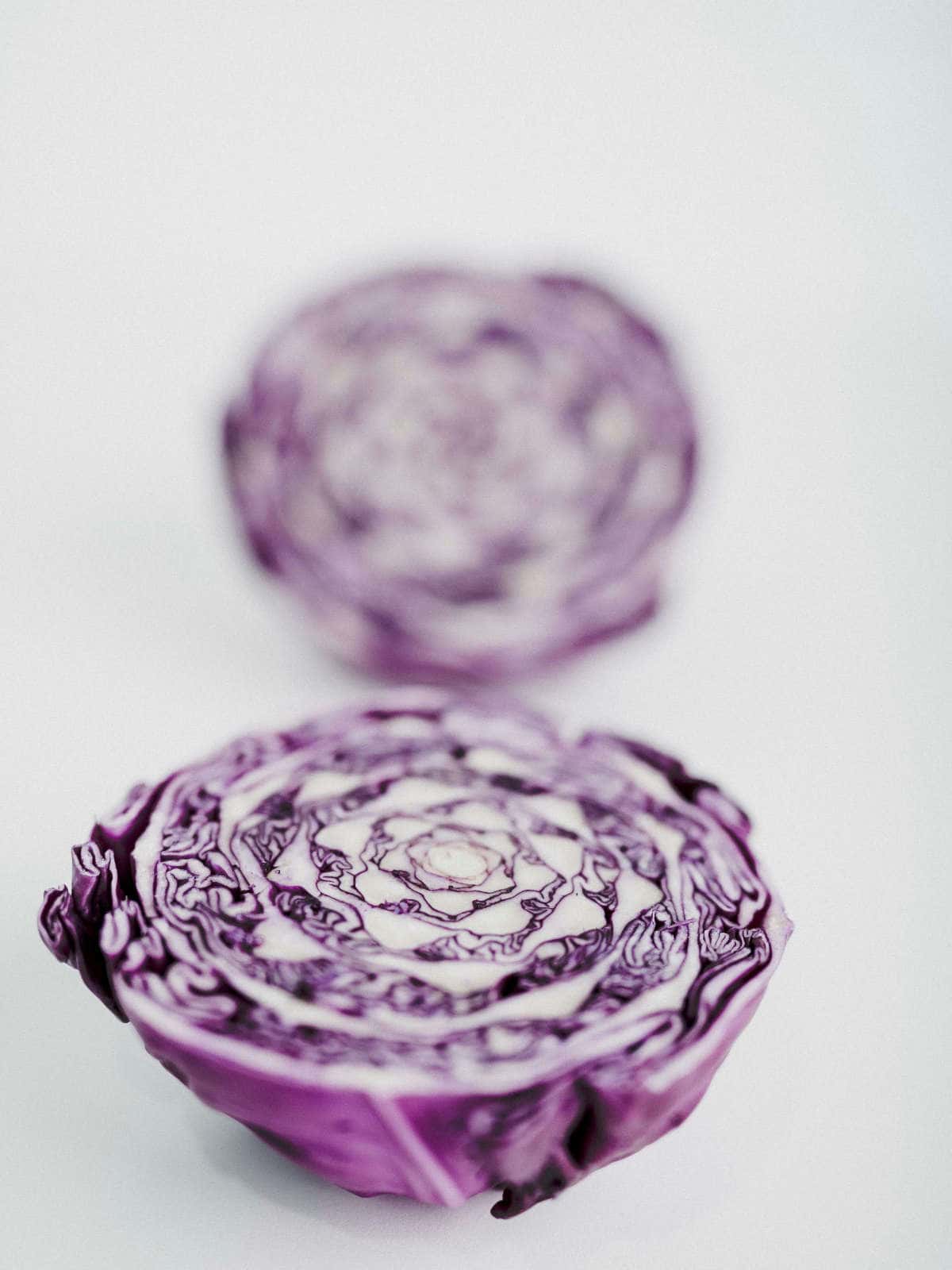 A purple cabbage cut in half.