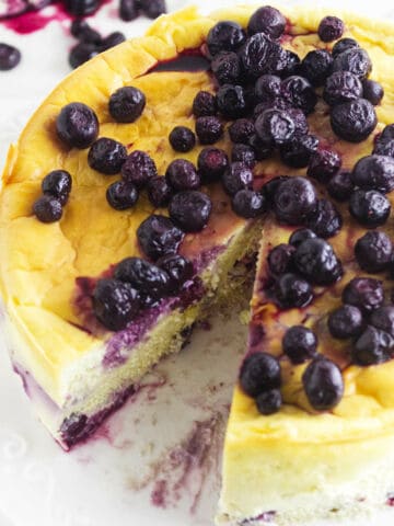 sugar free blueberry cheesecake with a slice removed.