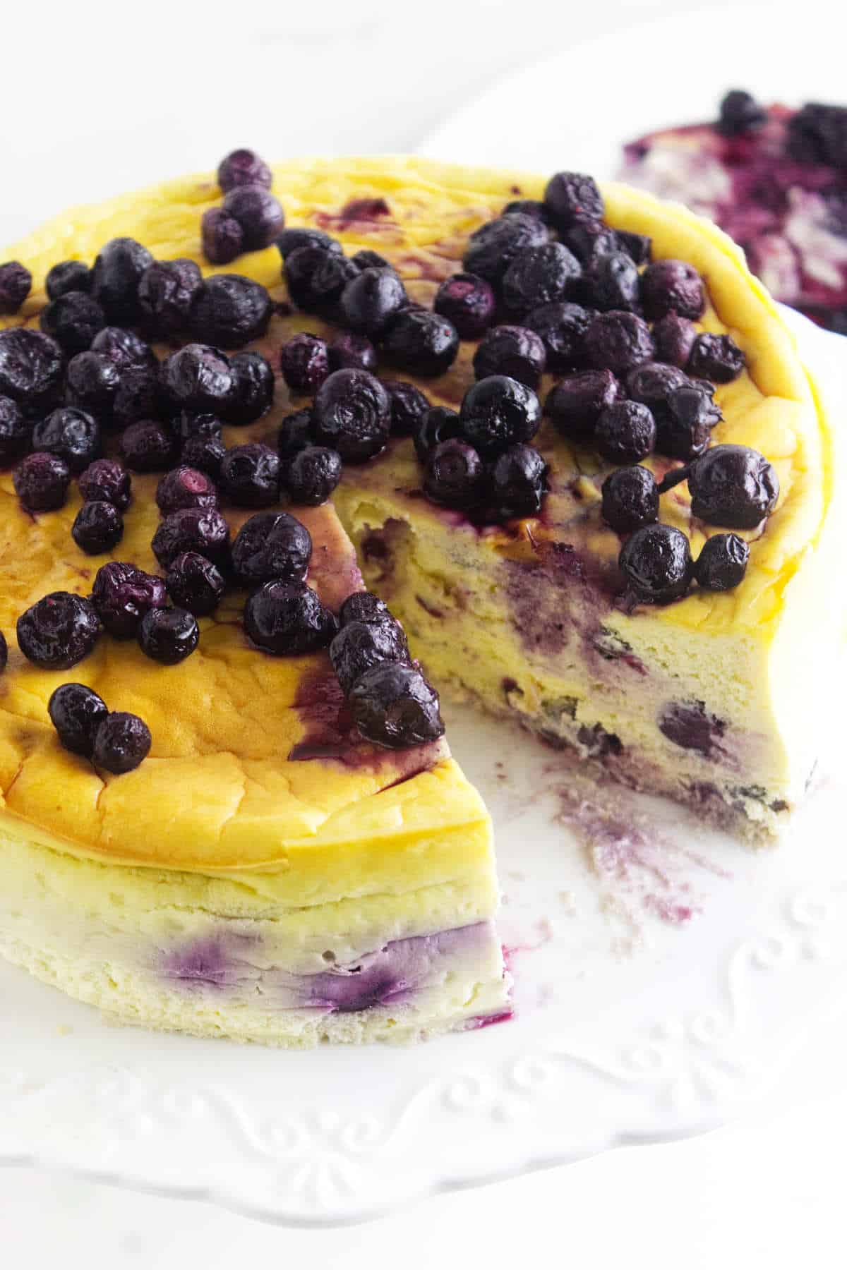 sugar-free blueberry cheesecake with a slice removed.