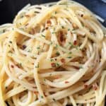 bowl of garlic and olive oil pasta with red pepper flakes.