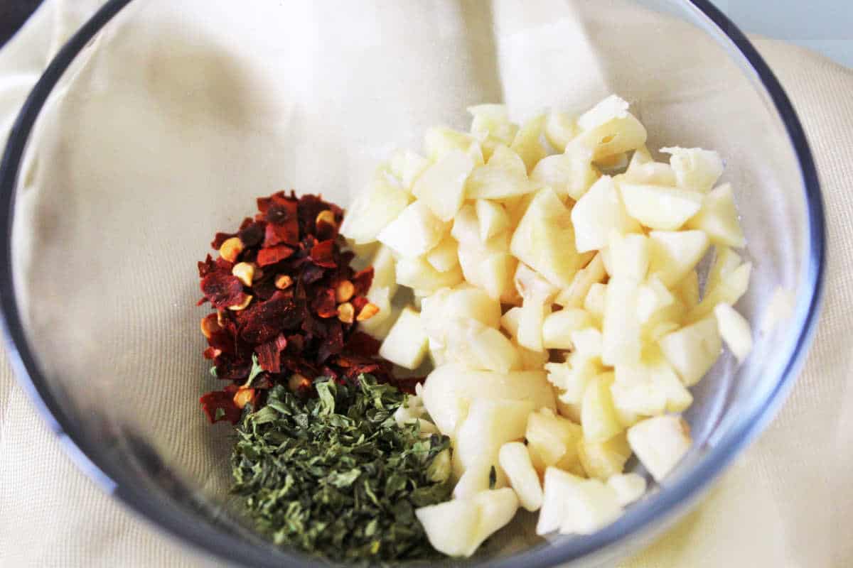 garlic, parsley, and red pepper flakes in a bowl.