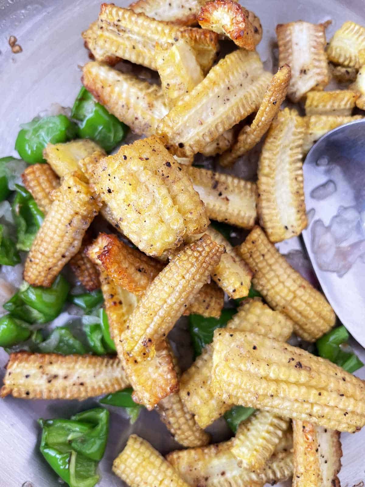 quick fried baby corn in a bowl.
