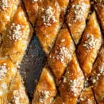 Classic walnut baklava cut into diamond shapes in a baking pan.