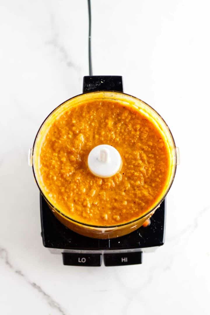 Onion and spices in a mini food processor.