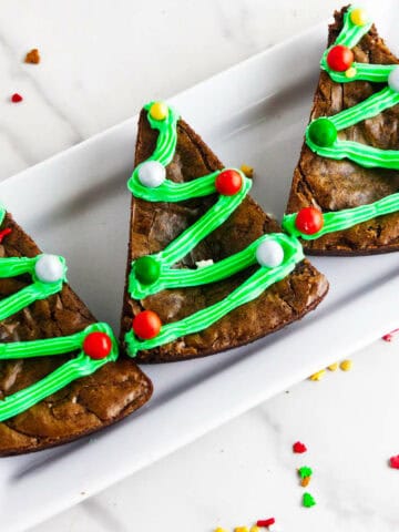 Christmas tree brownies on a serving platter.