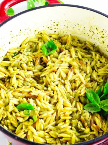 creamy pesto orzo in a dutch oven.