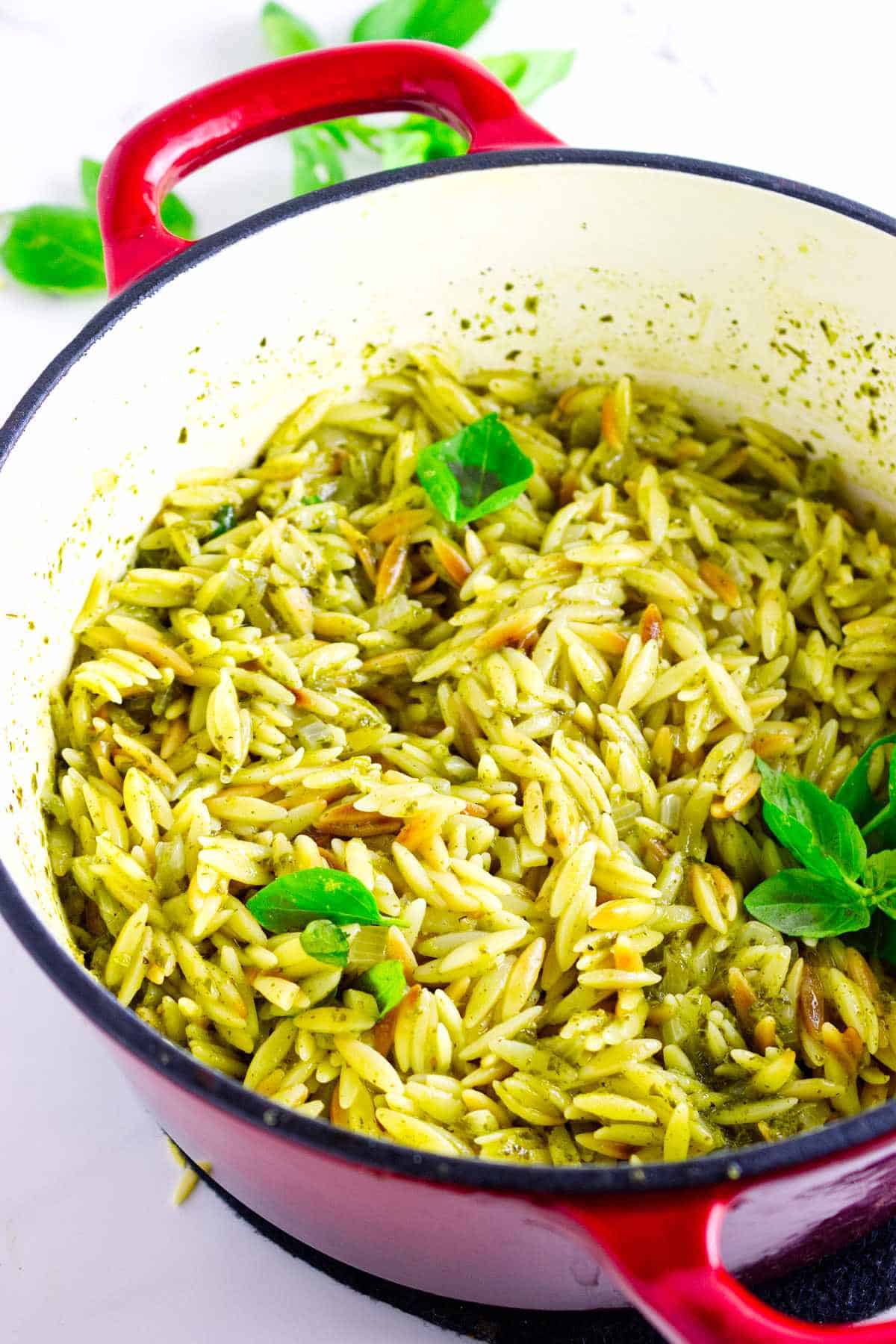 creamy pesto orzo in a dutch oven.