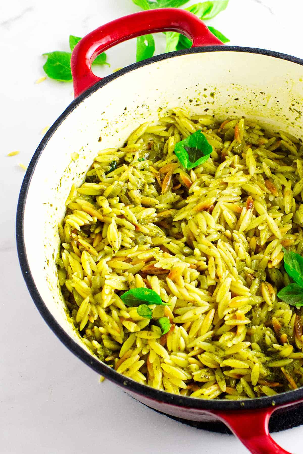 creamy pesto orzo in a dutch oven.