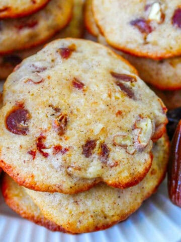 stack of date cookies on a plate.