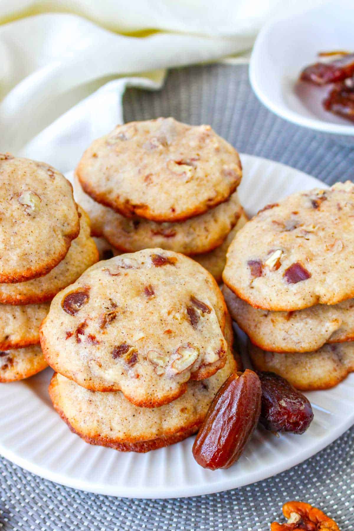 stack of date cookies on a plate.