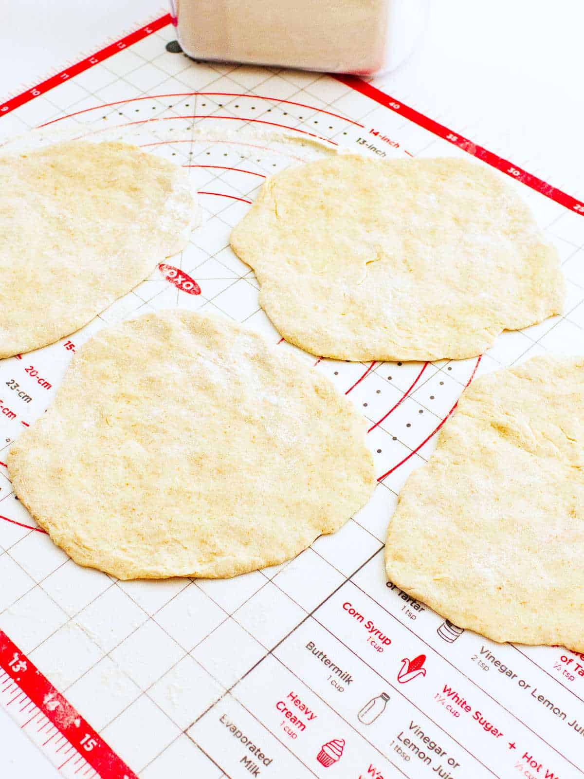 shaping dough into 10 flat discs.