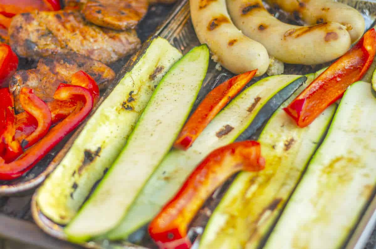 zucchini and peppers on a grill.