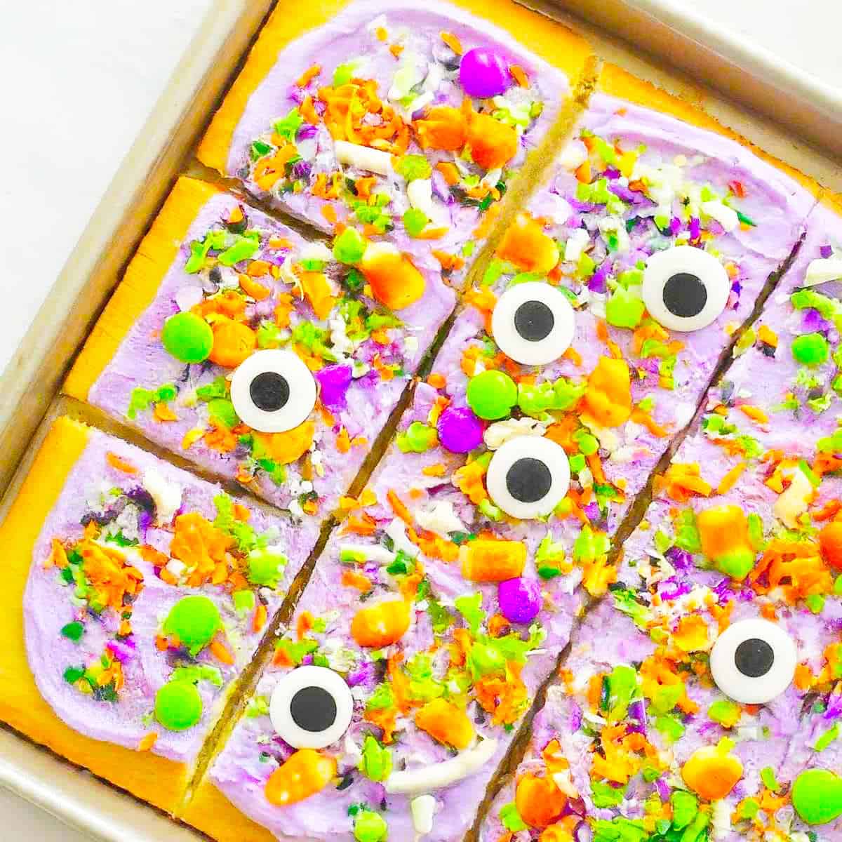 decorated cookie bars on a sheet pan.