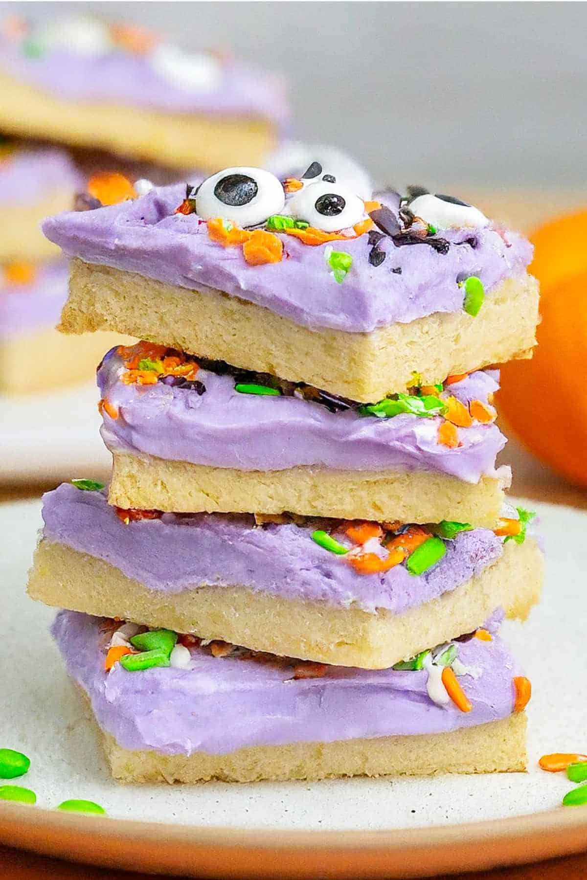 stack of sheet pan sugar cookies decorated for halloween.