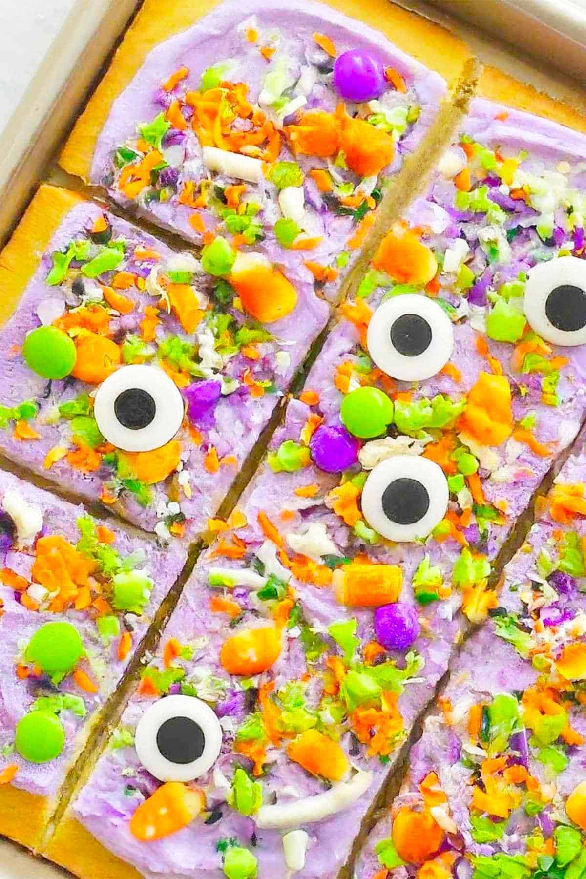 decorated cookie bars on a sheet pan.