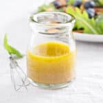 Salad dressing with olive oil, honey, mustard and white balsamic vinegar.