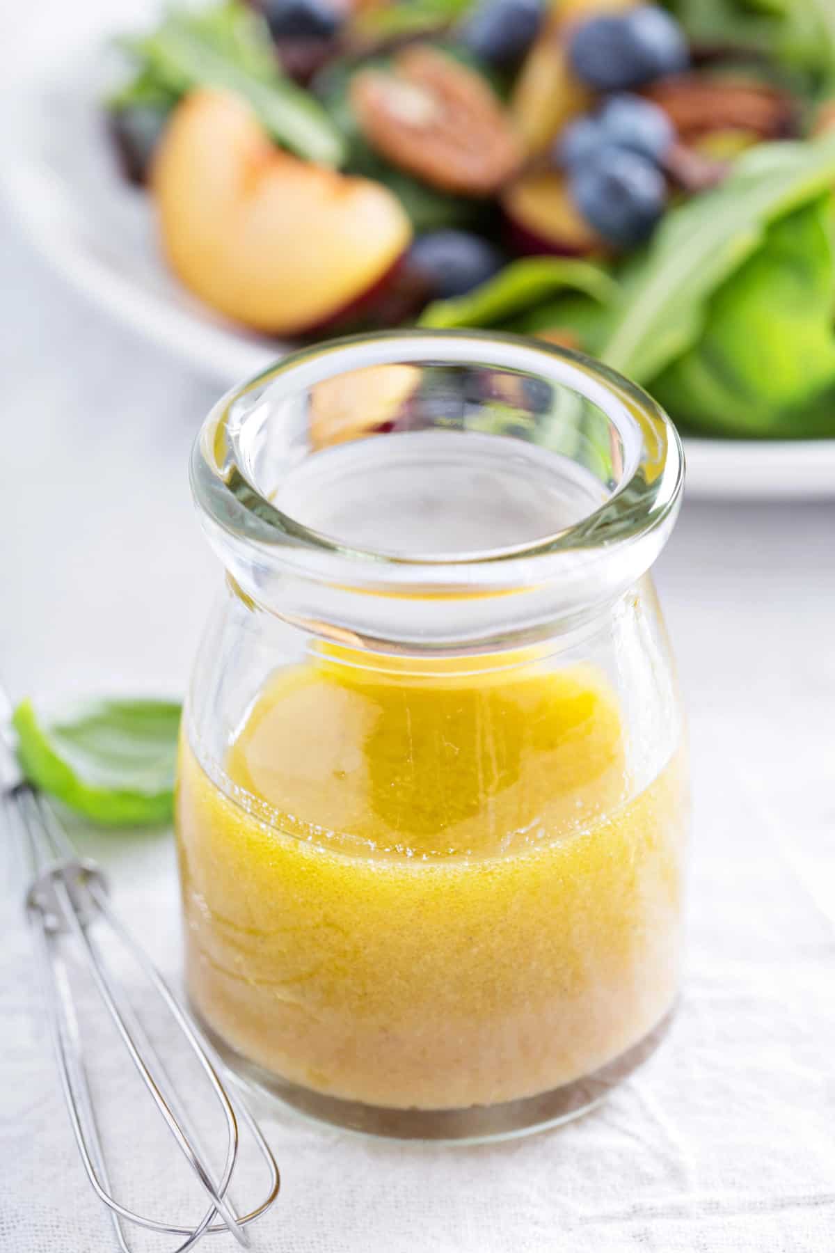 Salad dressing with olive oil, honey, mustard and white balsamic vinegar.