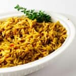 orzo pilaf in a serving dish.