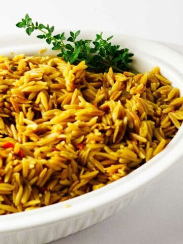 orzo pilaf in a serving dish.