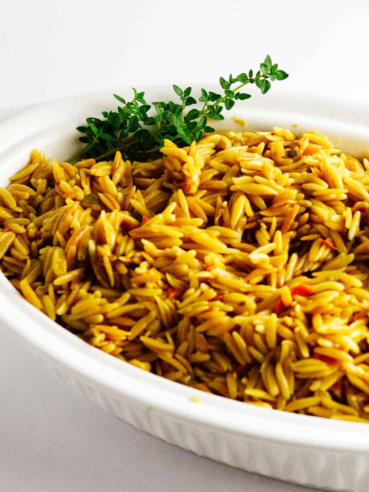 orzo pilaf in a serving dish.