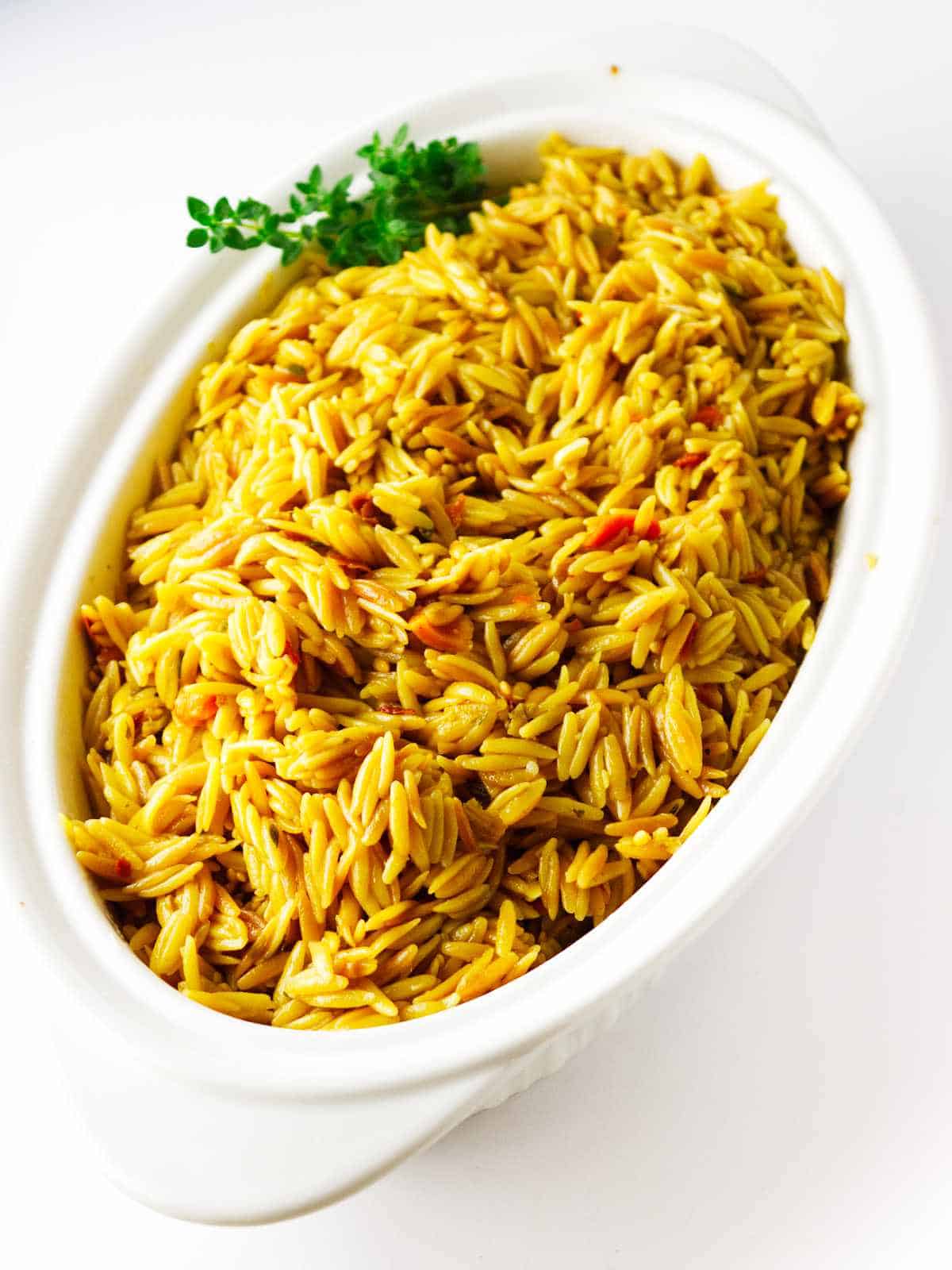 orzo pilaf in a serving dish.