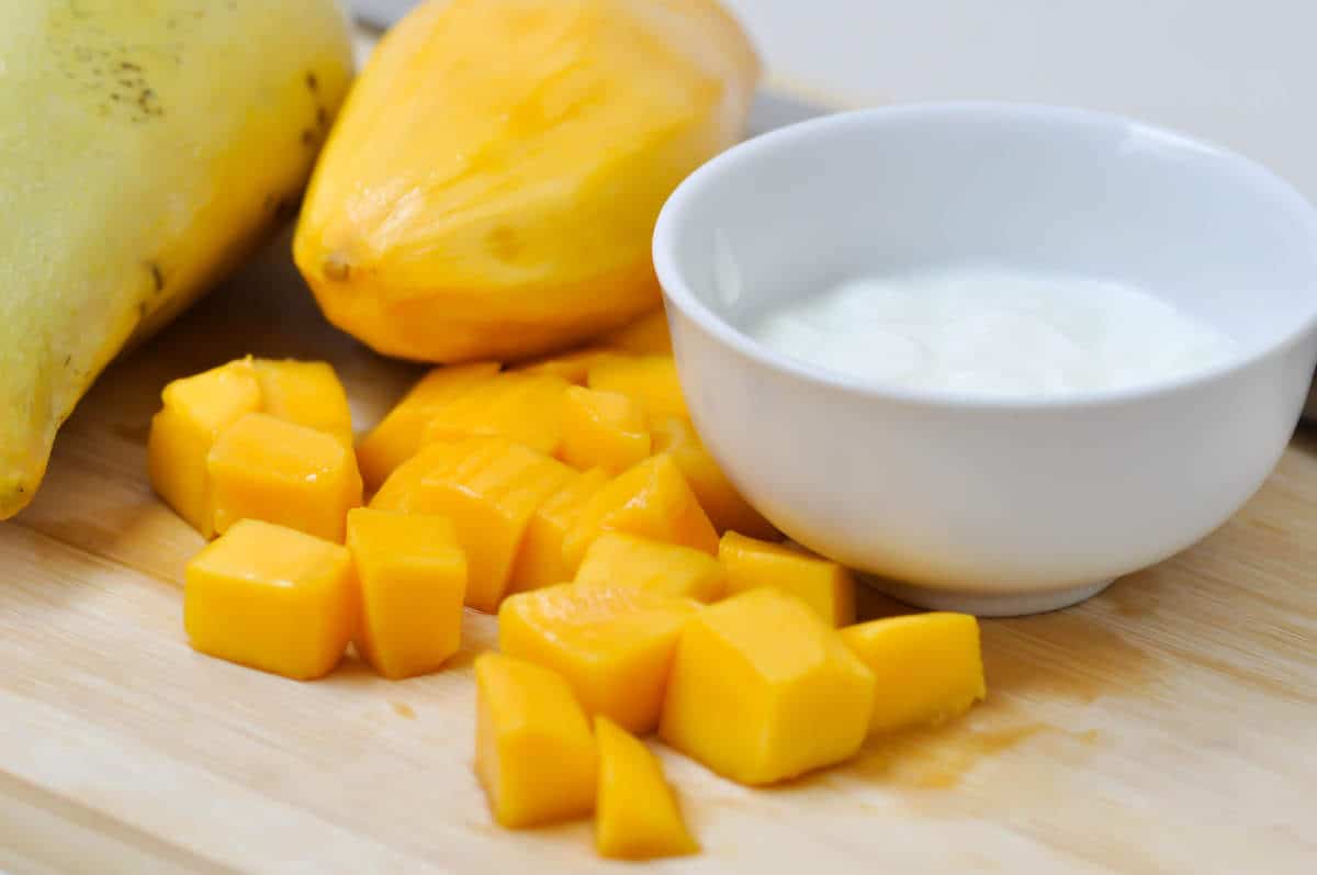 mango or chopped mango on chopping board