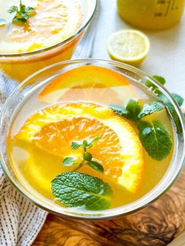 Orange mint lemonade in a glass.