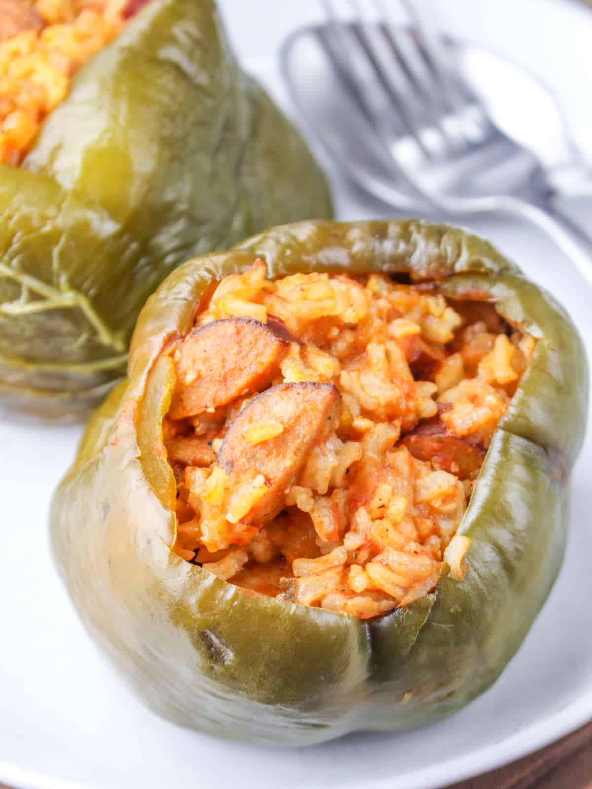 Slow cooker Cajun rice and sausage stuffed green bell peppers.