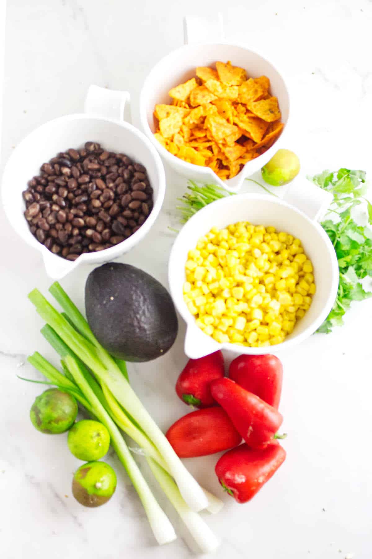 ingredients for making a doritos corn salad.
