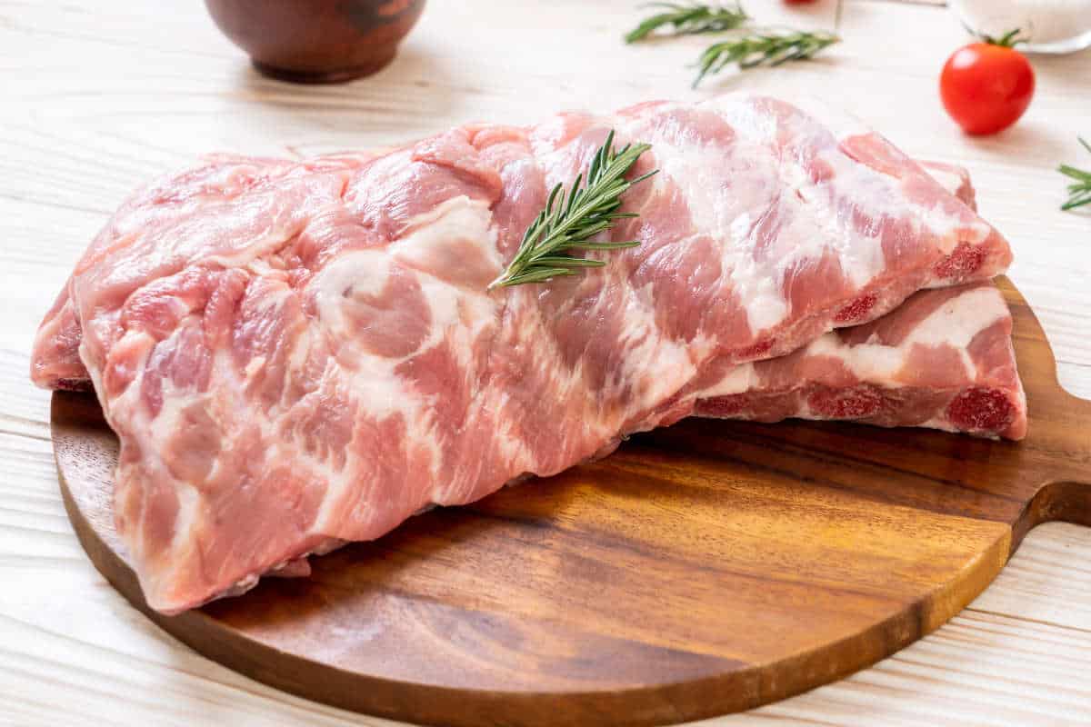 Fresh raw pork ribs with ingredients.
