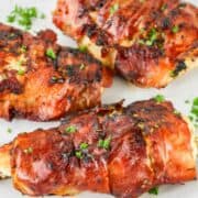 Prosciutto wrapped (chicken saltimbocca) chicken on a plate.