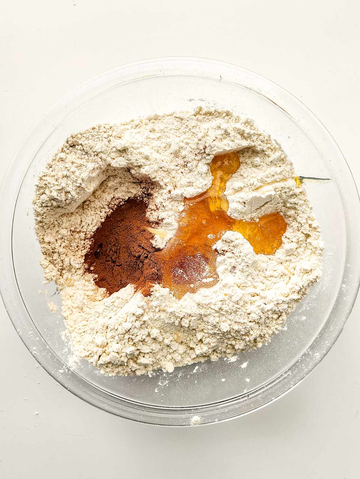 honey and cinnamon added to flour and yeast mixture.