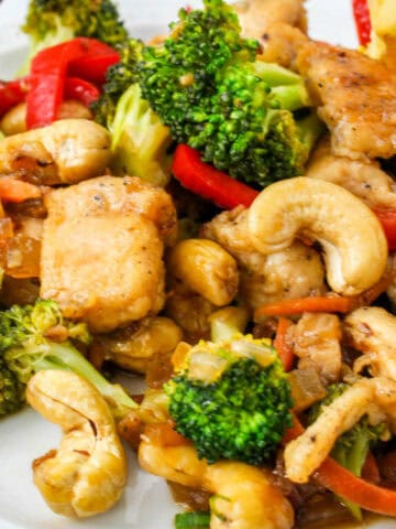 honey garlic cashew chicken on a serving plate.