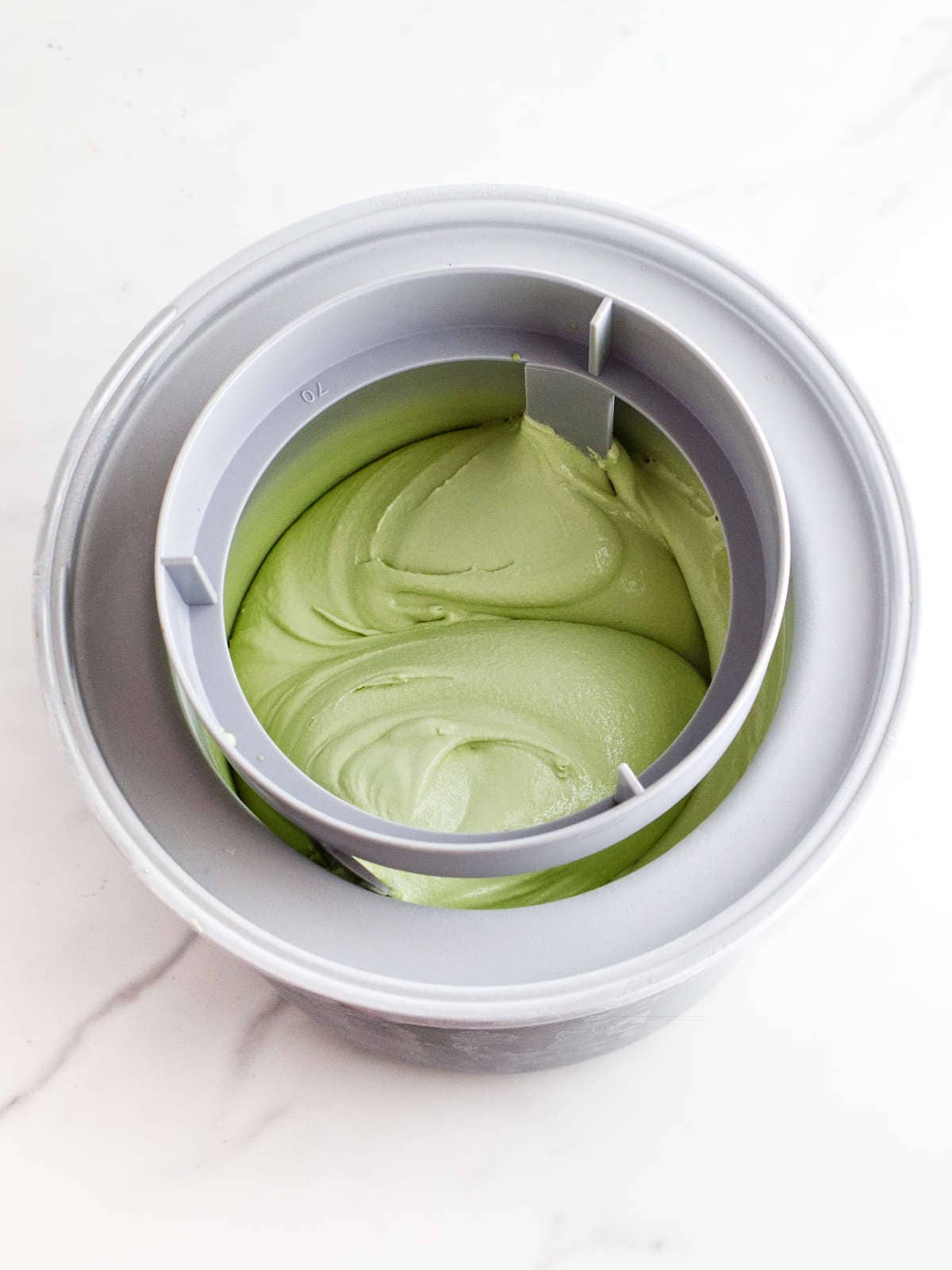 Matcha tea ice cream in ice cream maker.