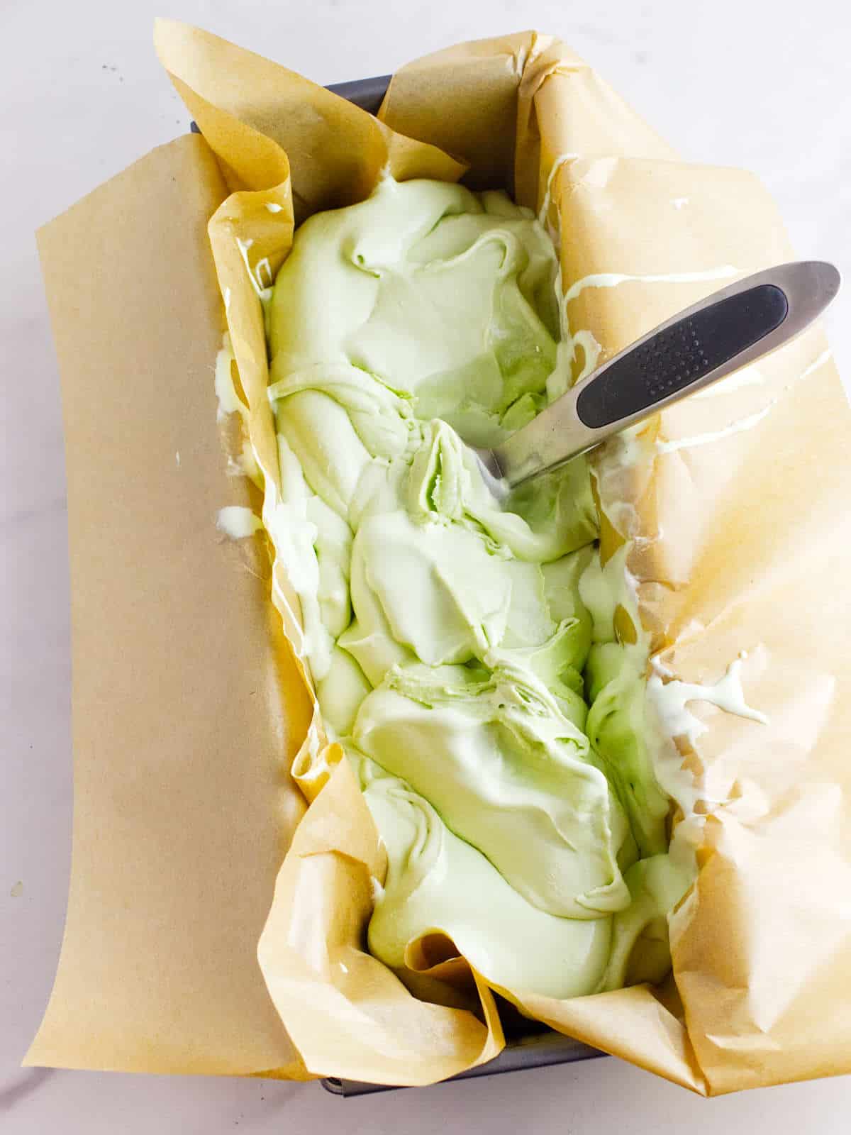 Matcha green tea ice cream in loaf pan for hardening.