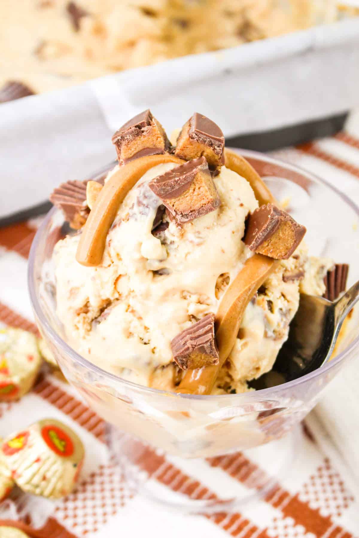 Reese's peanut butter cup ice cream with drizzled peanut butter topping.