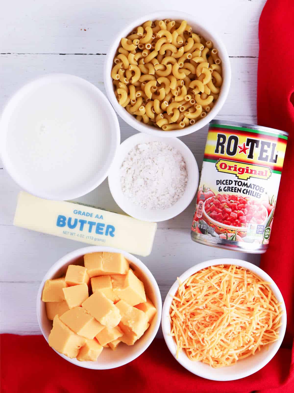 ingredients for macaroni and cheese with Velveeta cheese and Rotel tomatoes.