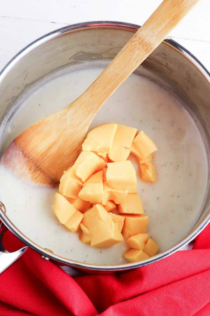 Velveeta cheese melting in a sauce pan.