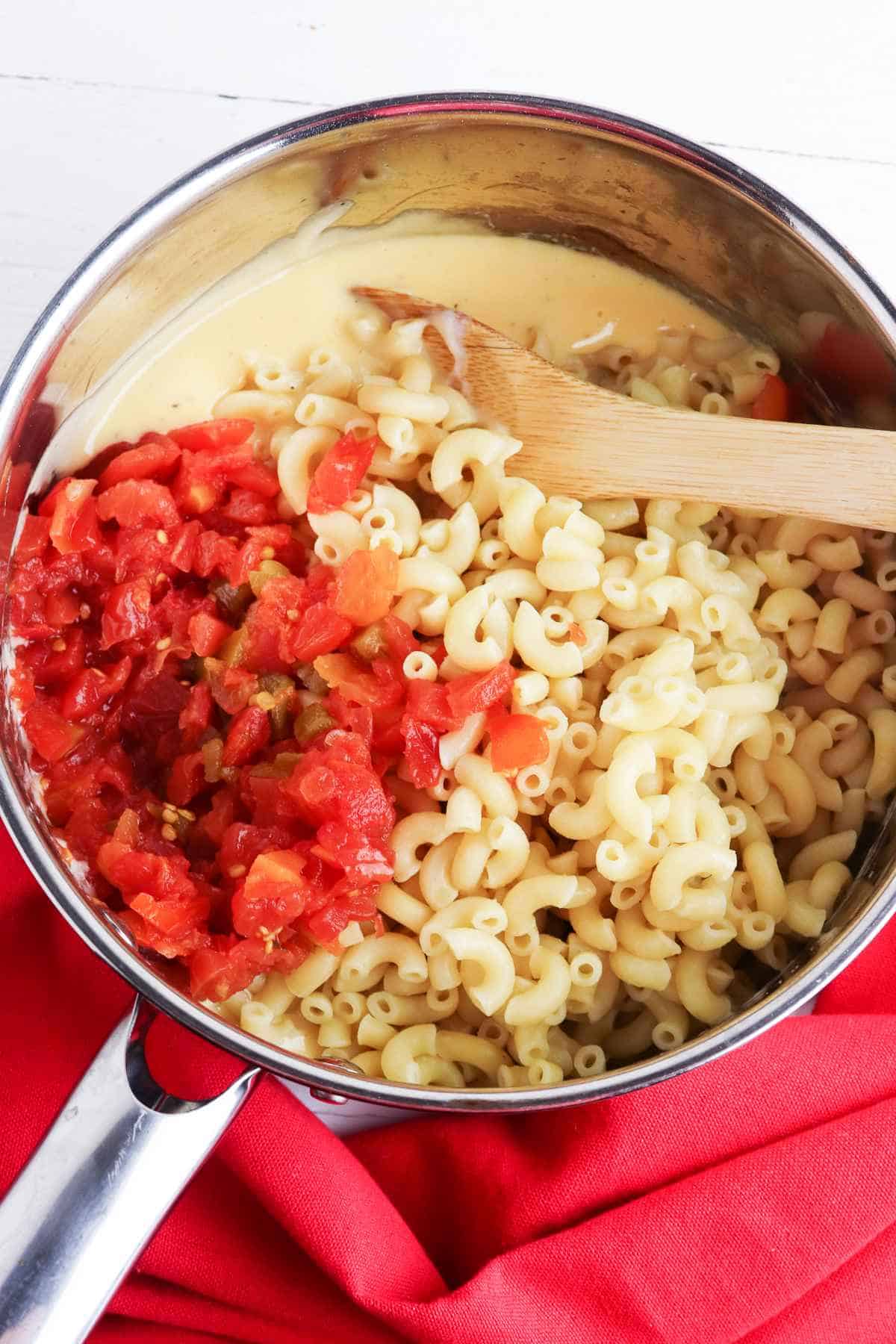 cooked elbow macaroni and Rotel tomatoes added to melted Velveeta cheese mixture.