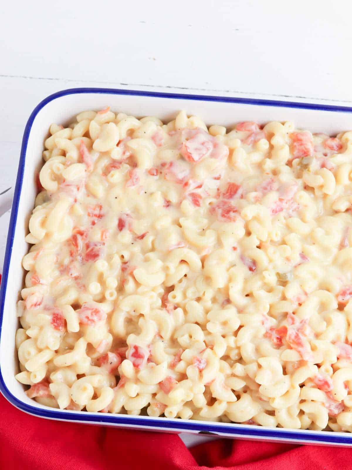 Rotel mac and cheese spread into a baking dish.