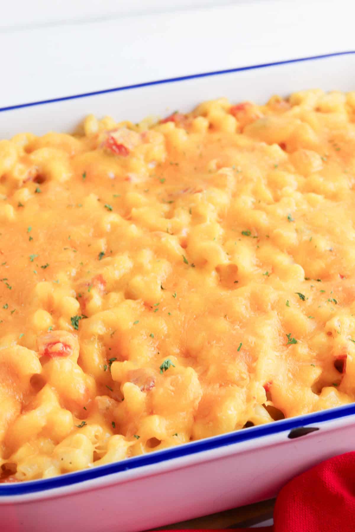 Oven baked rotel mac and cheese in a casserole.