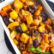 tzimmes made from rainbow carrots, orange sweet potatoes, prunes and dried fruit.